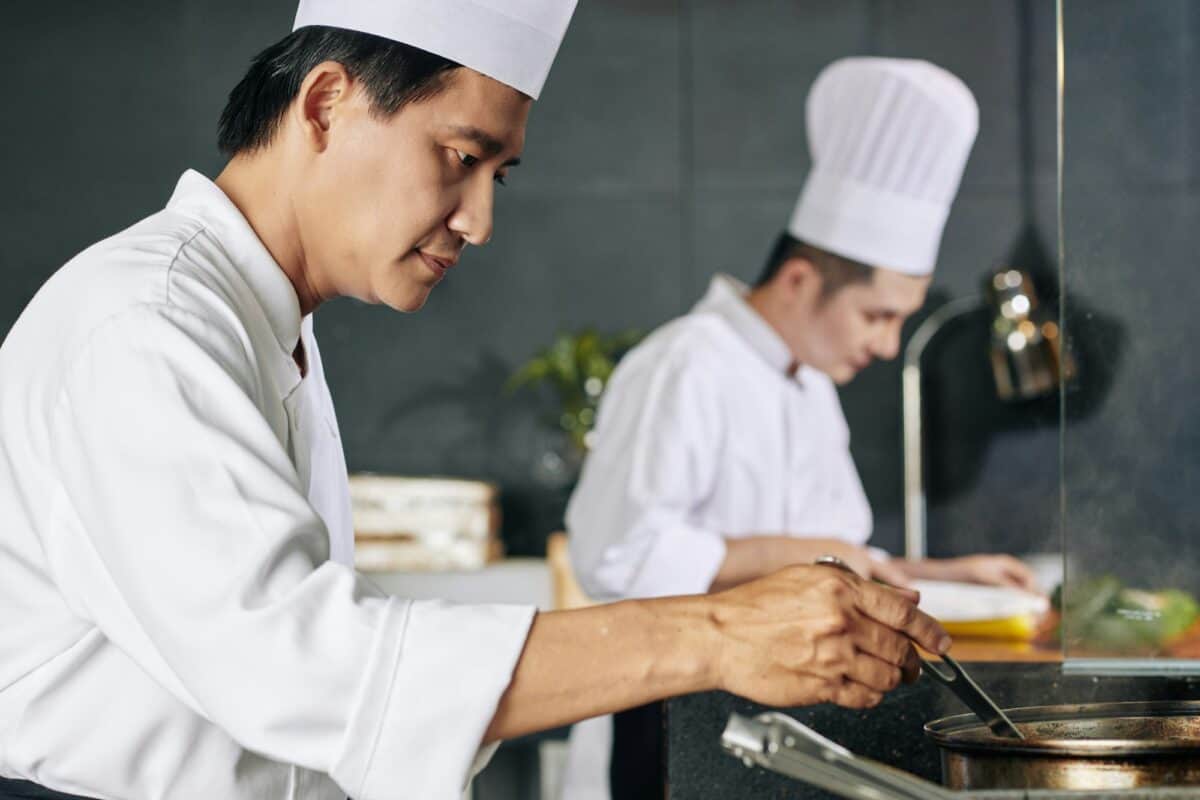 Asian man cooking in the kitchen