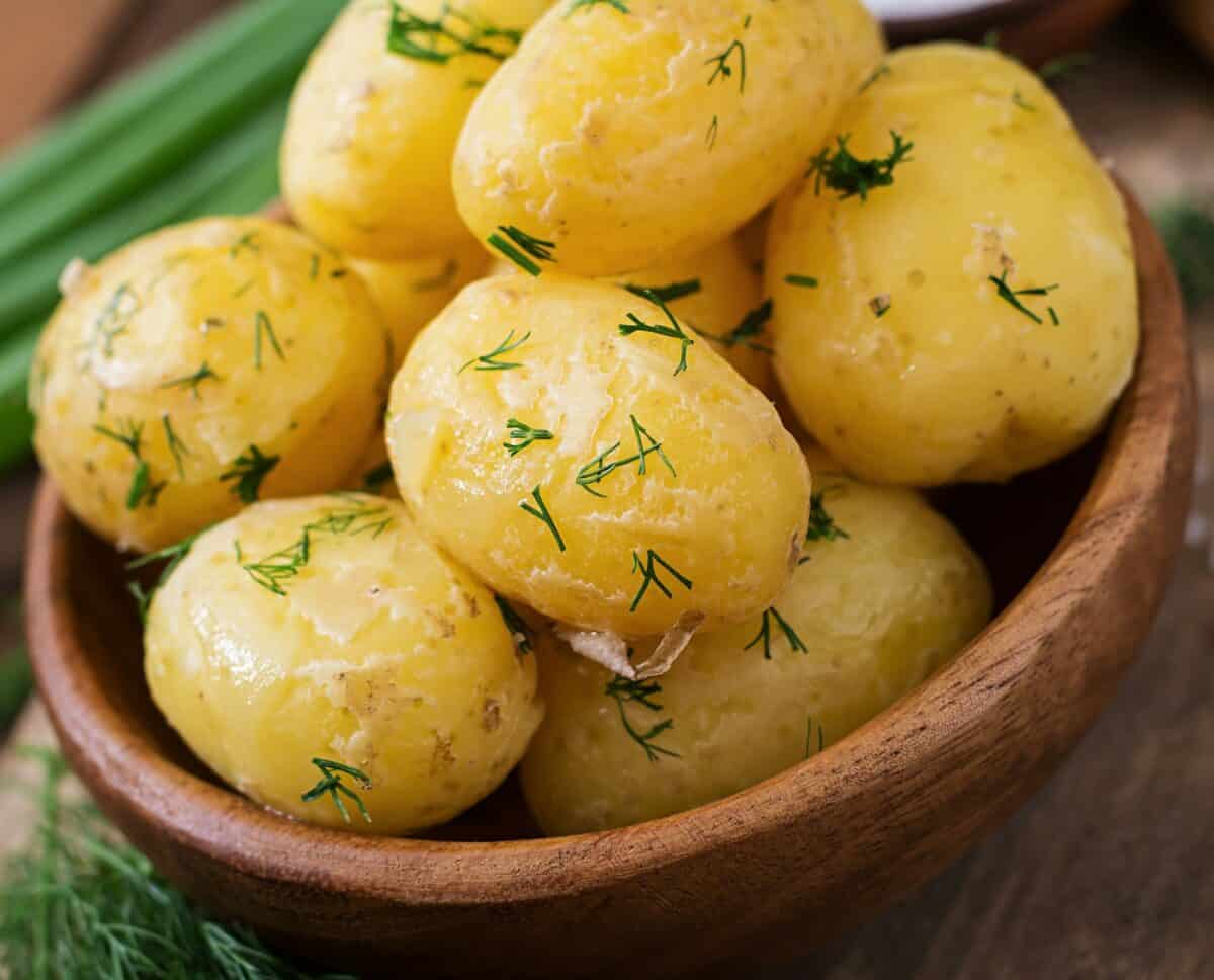 Boiled new potatoes seasoned with dill and butter