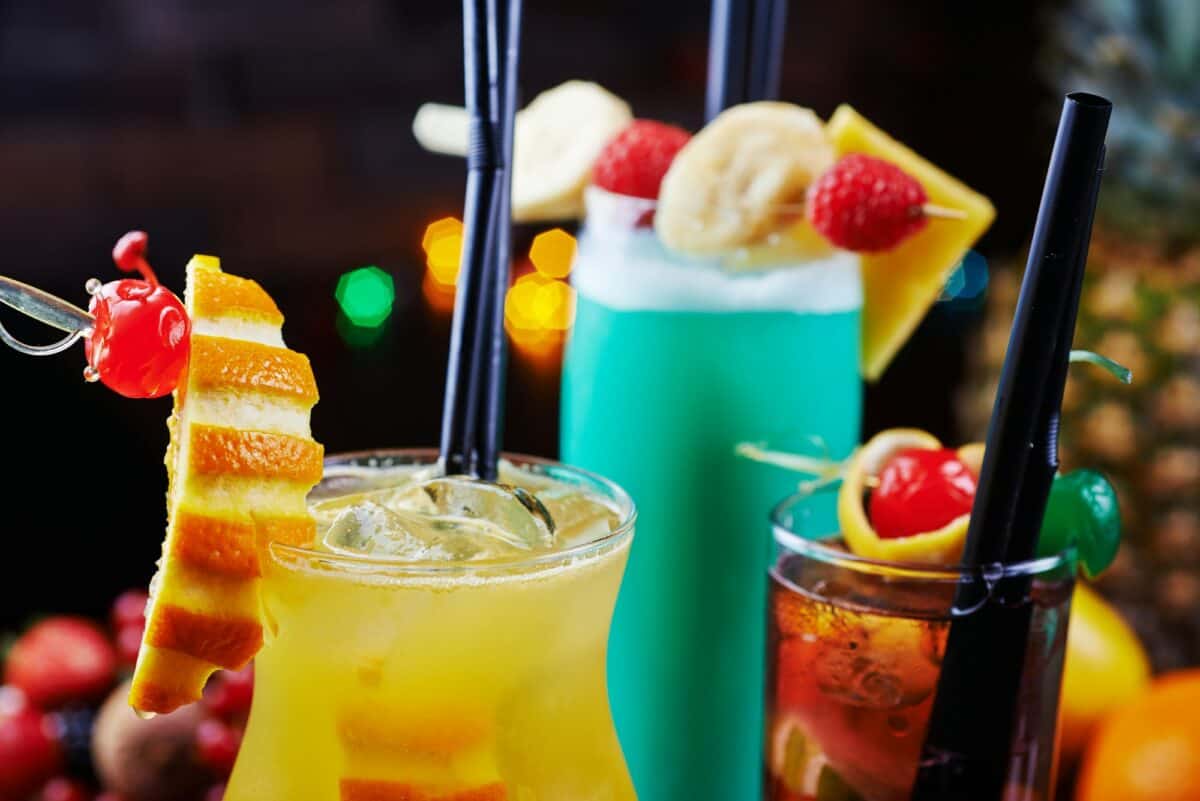 bright beautiful bright glass of alcoholic cocktail or lemonade on a table in a bar. soft focus.