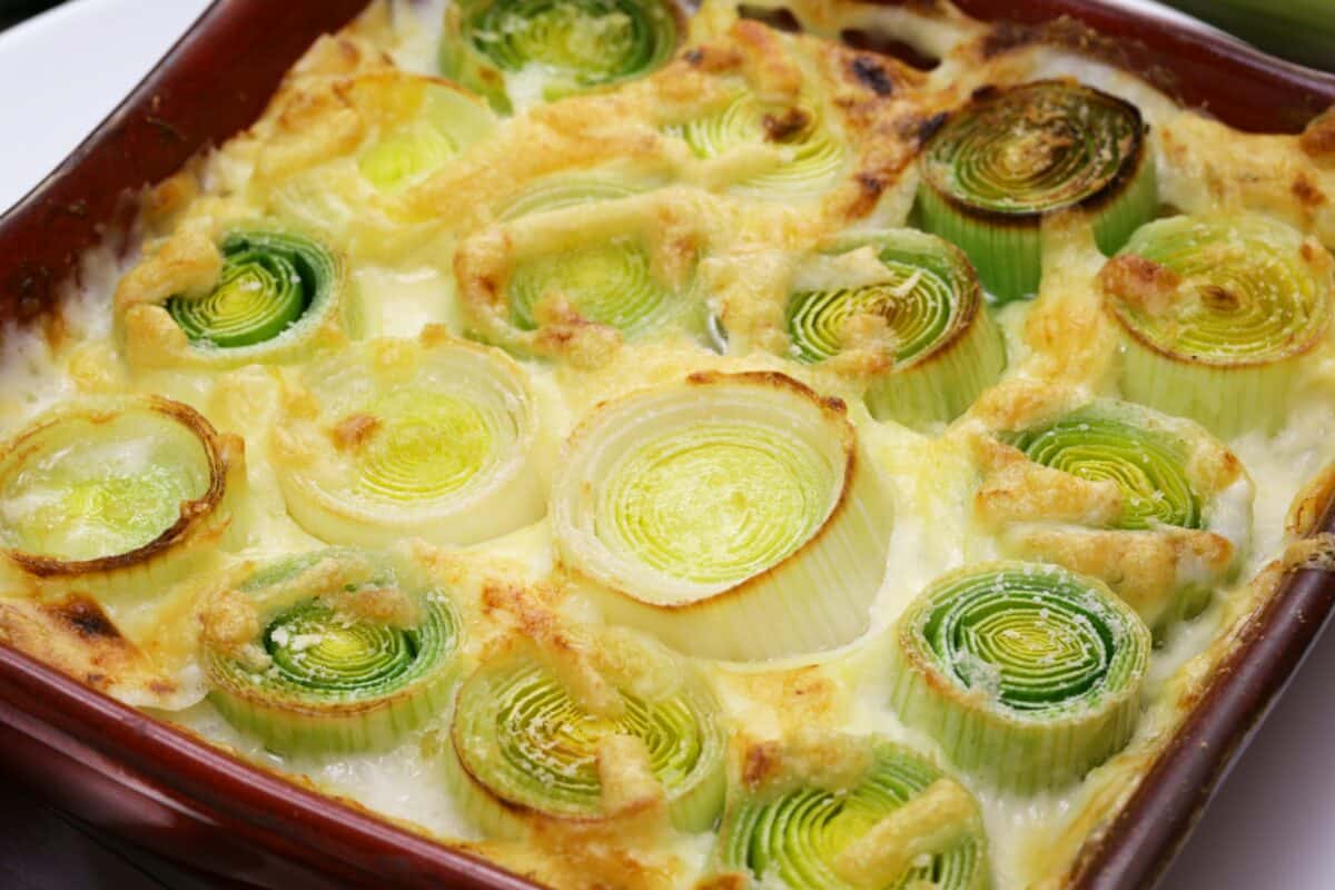 creamy leek gratin close up shot, french cuisine