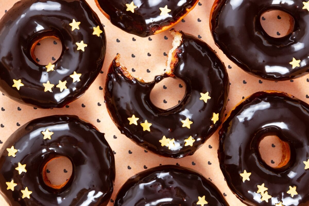Donuts with chocolate mirror icing and sprinkles