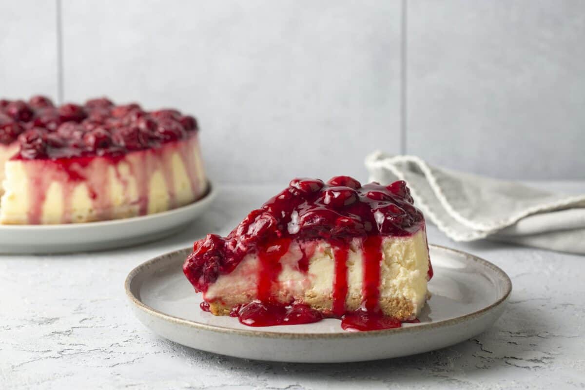Fresh baked cheesecake with a cherry berry topping