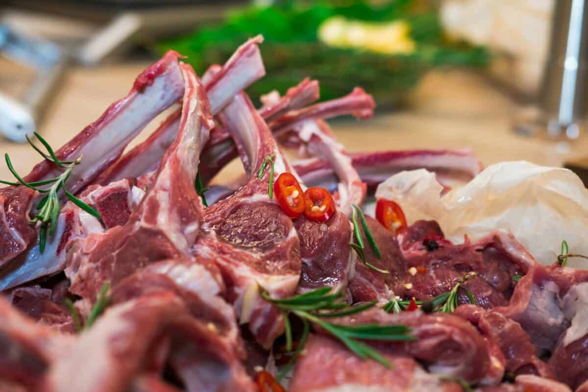 Fresh lamb saddle on the bone, meat with streaks of fat