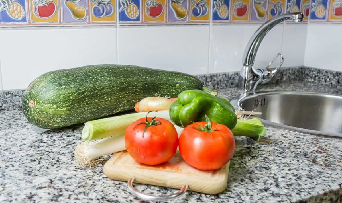 Fresh vegetables on cutting board in the kitchen