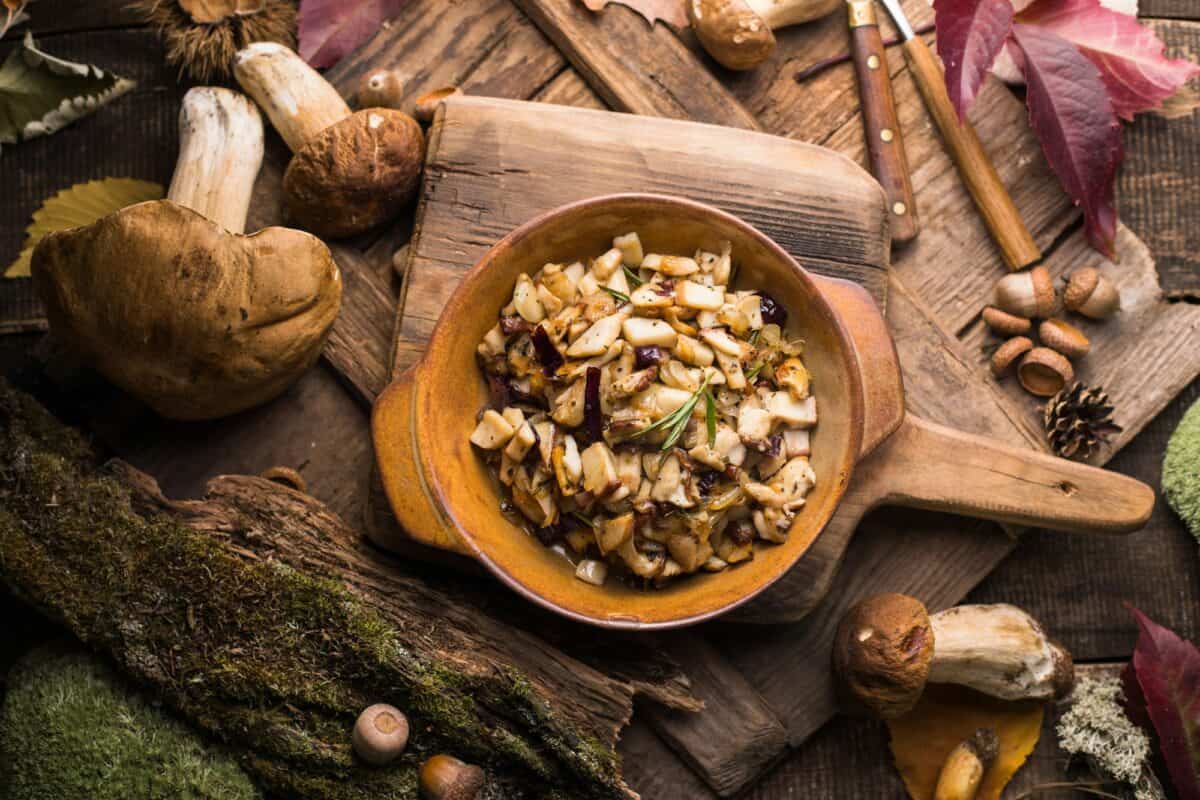 Fried forest mushrooms, boletus, onions. Rustic dish in a frying pan