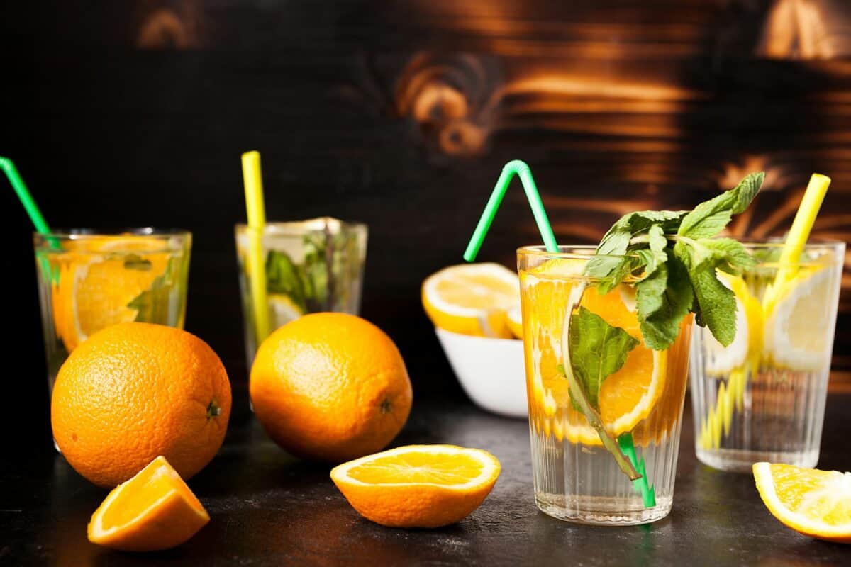 Glasses with orangeade and lemonade