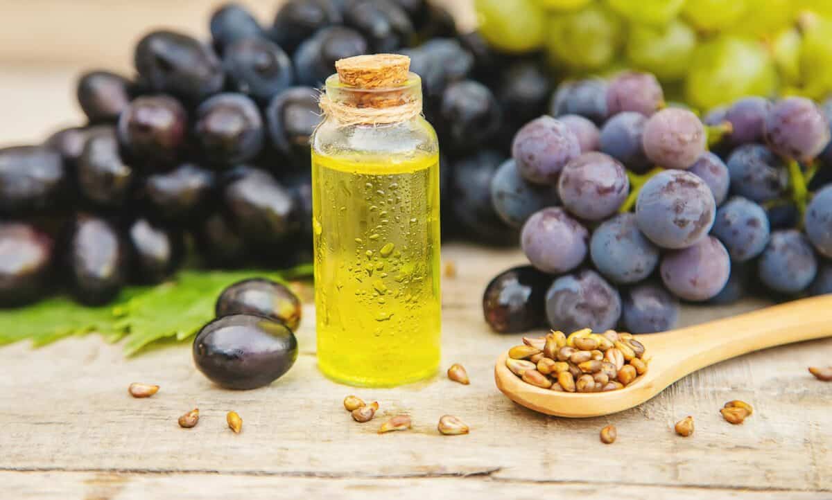 Grape seed oil in a small bottle. Selective focus.