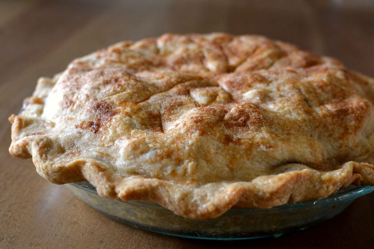 Homemade whole apple pie with a tender flaky crust dough pastry