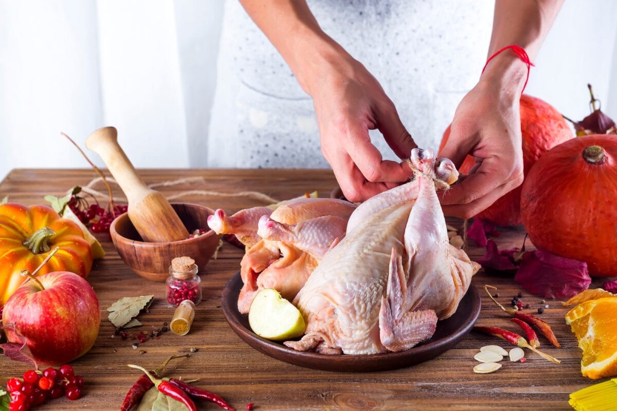 Housewife prepares roast chicken
