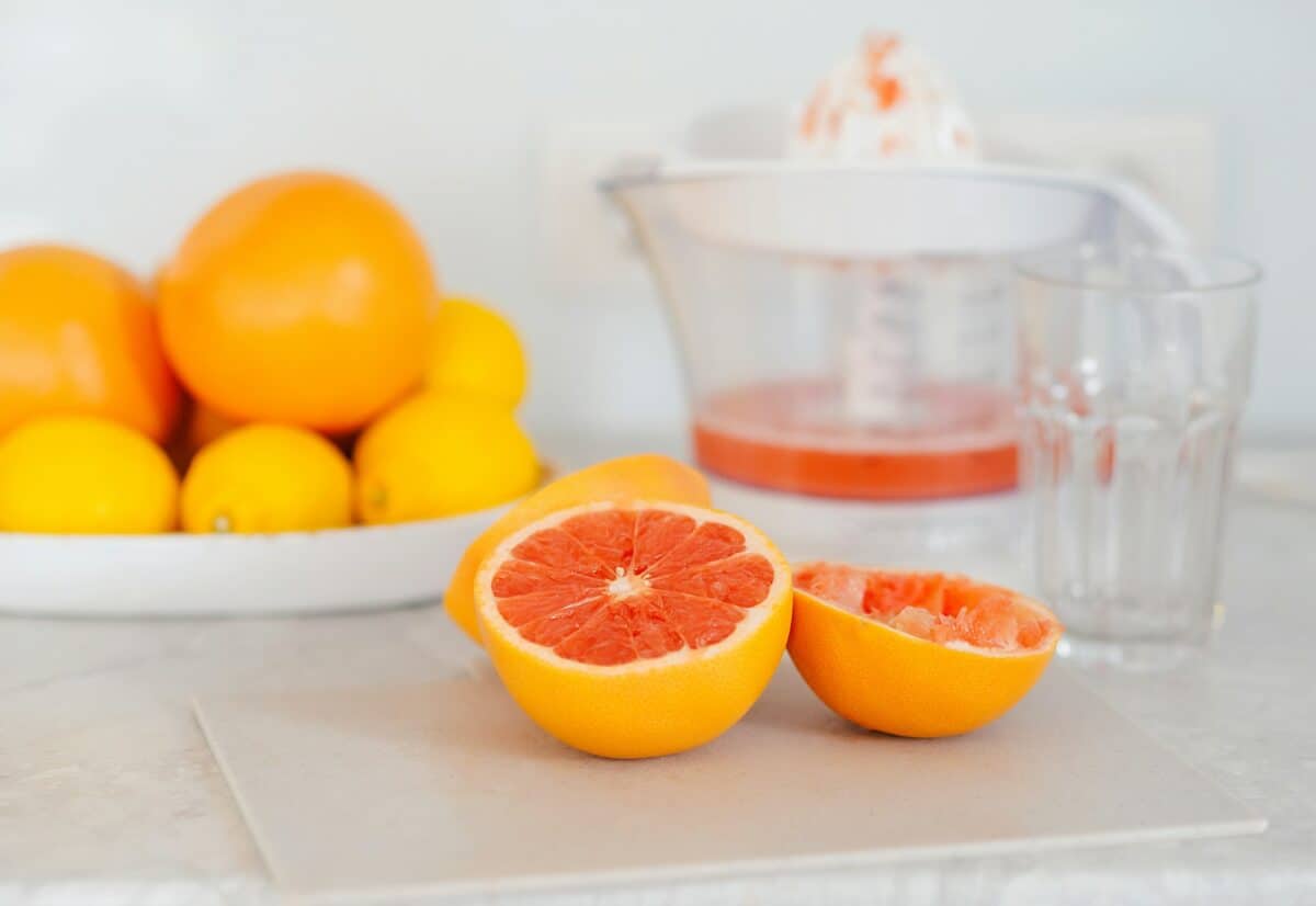 Juice extractor or juicer preparing to make grapefruit juice