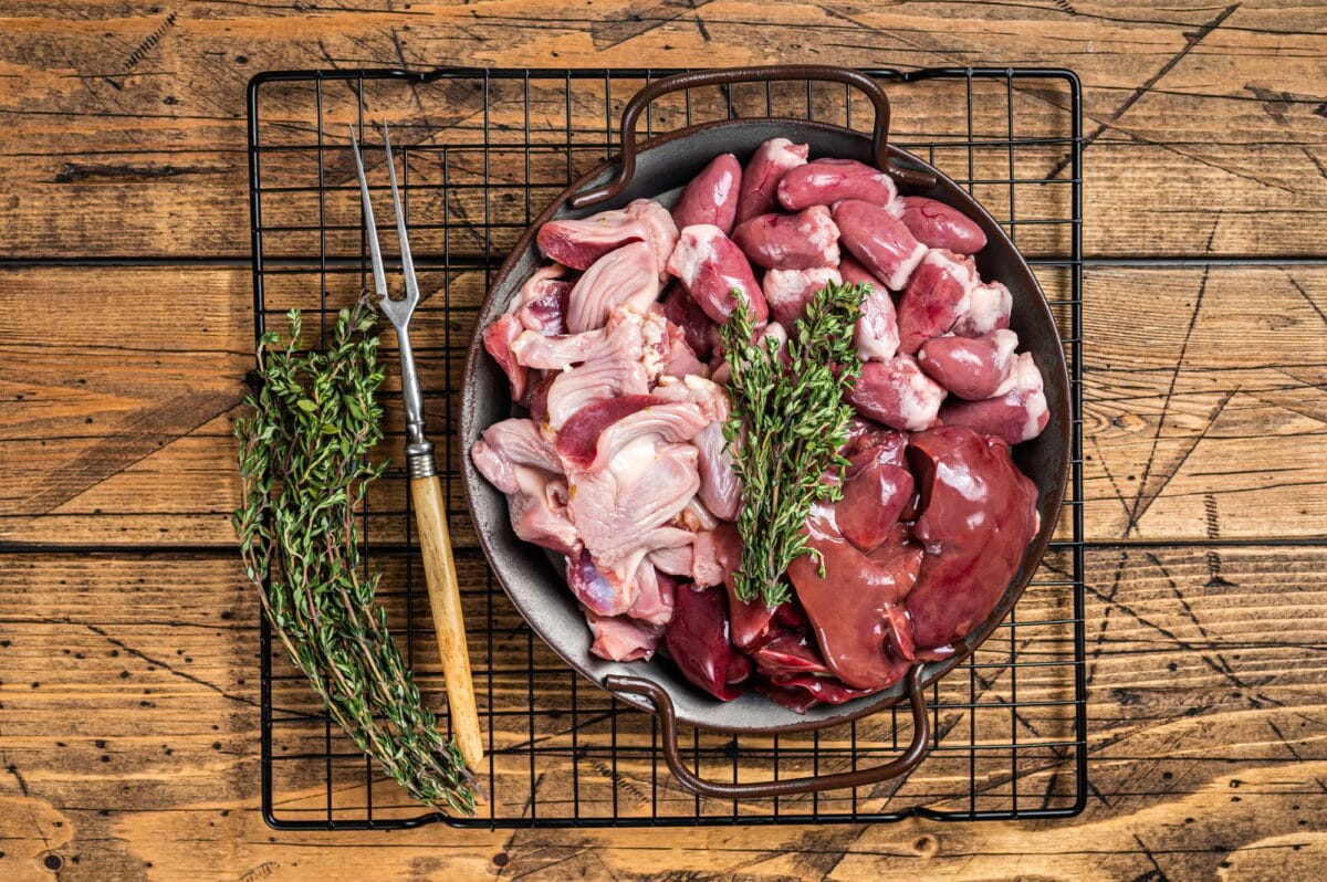 Raw bird giblets meat set, chicken offals, liver, hearts, gizzards Stomach.